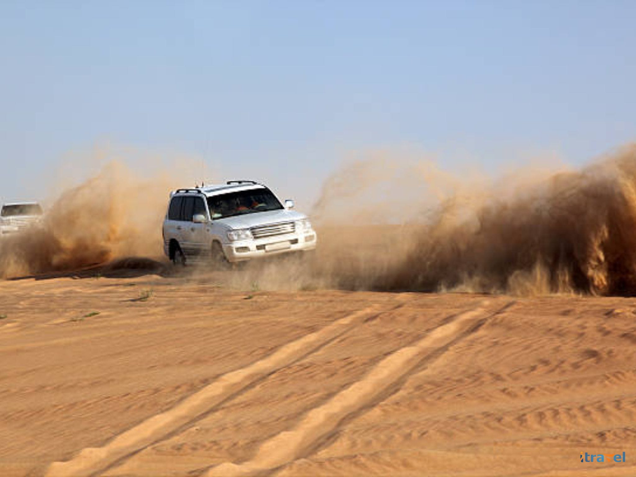 Desert safari 4x4 on red dunes near Dubai at sunset